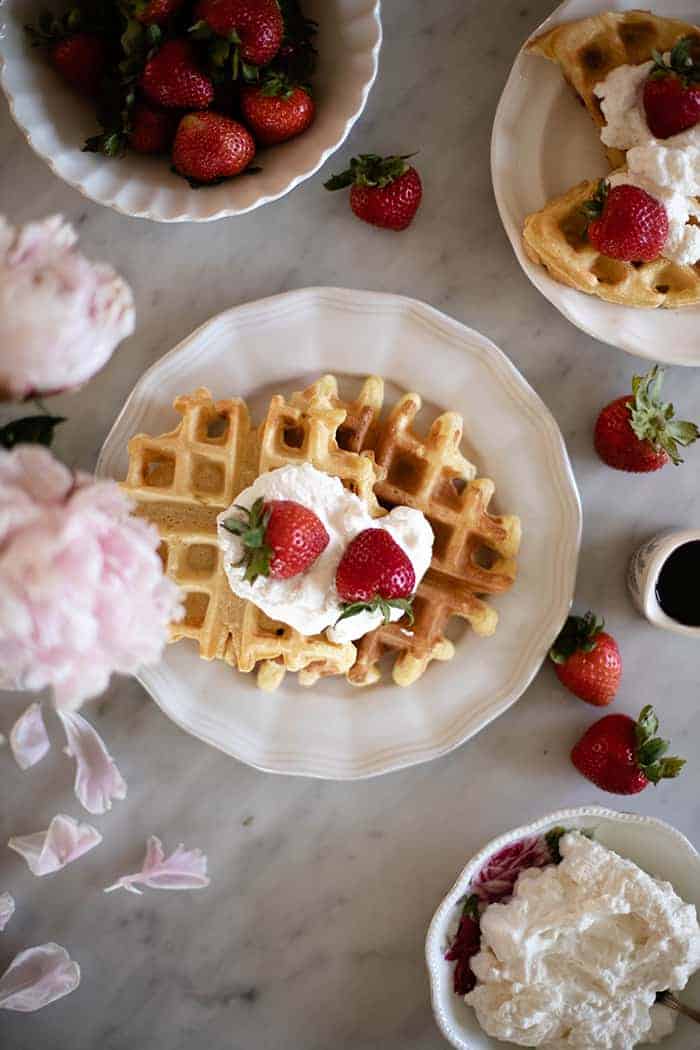 waffles with fresh strawberries and whipped cream