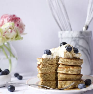 oat flour pancakes with blueberries and whipped cream